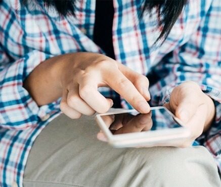 Close up of a person using a smartphone