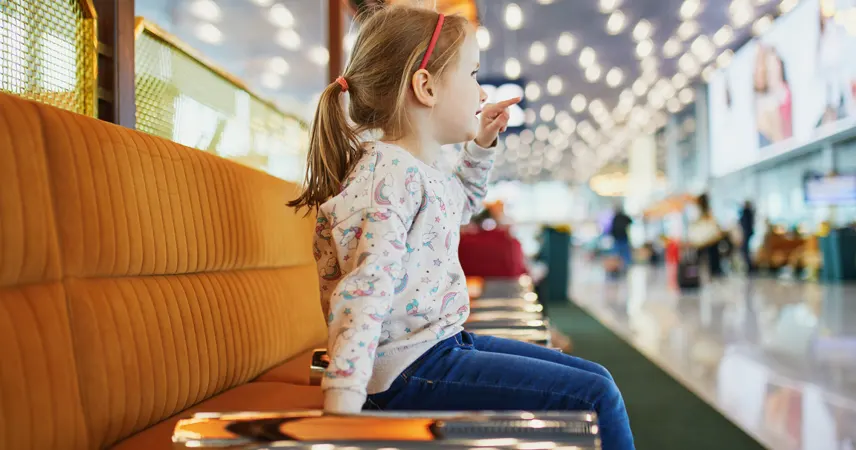 kid playing at airport